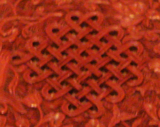 Form with 49 crossings, 47 of which are structurally significant. Photograph of ca. 400 year old Chinese lacquerware dish.